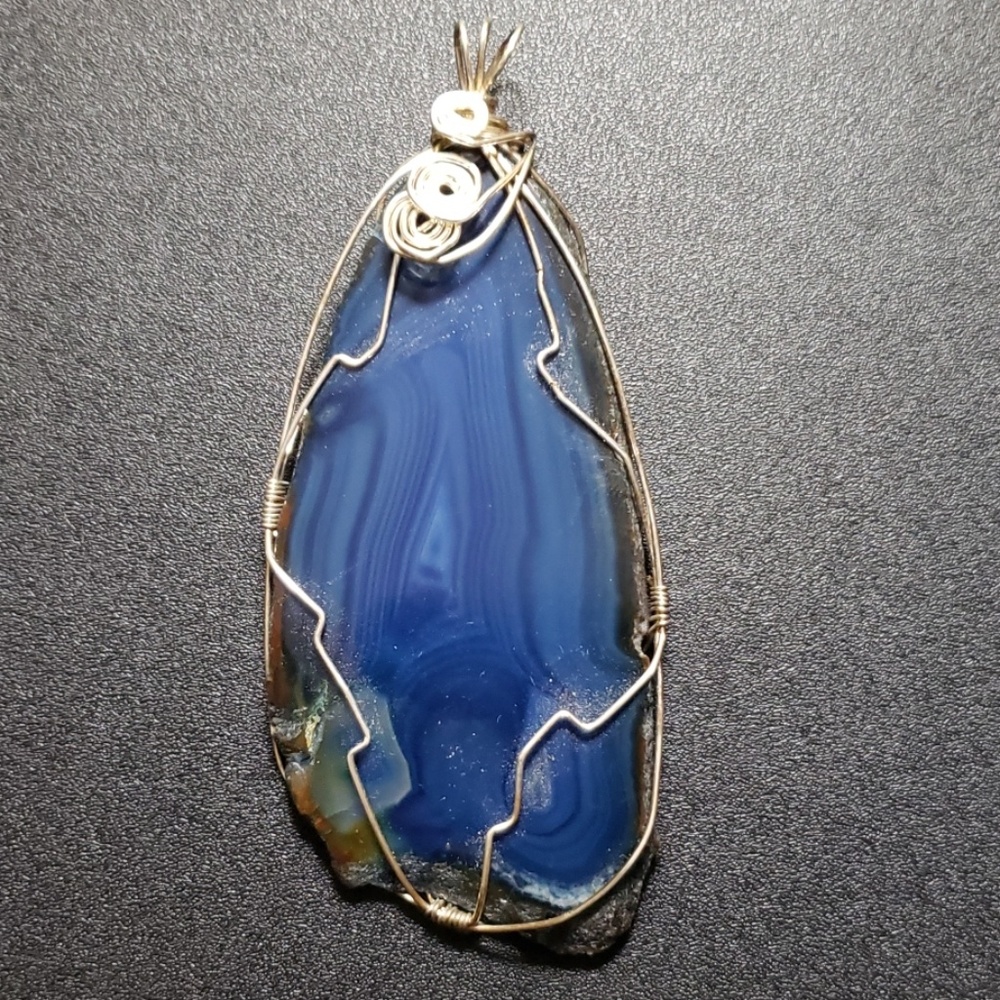 Polished blue agate pendant set in sterling
